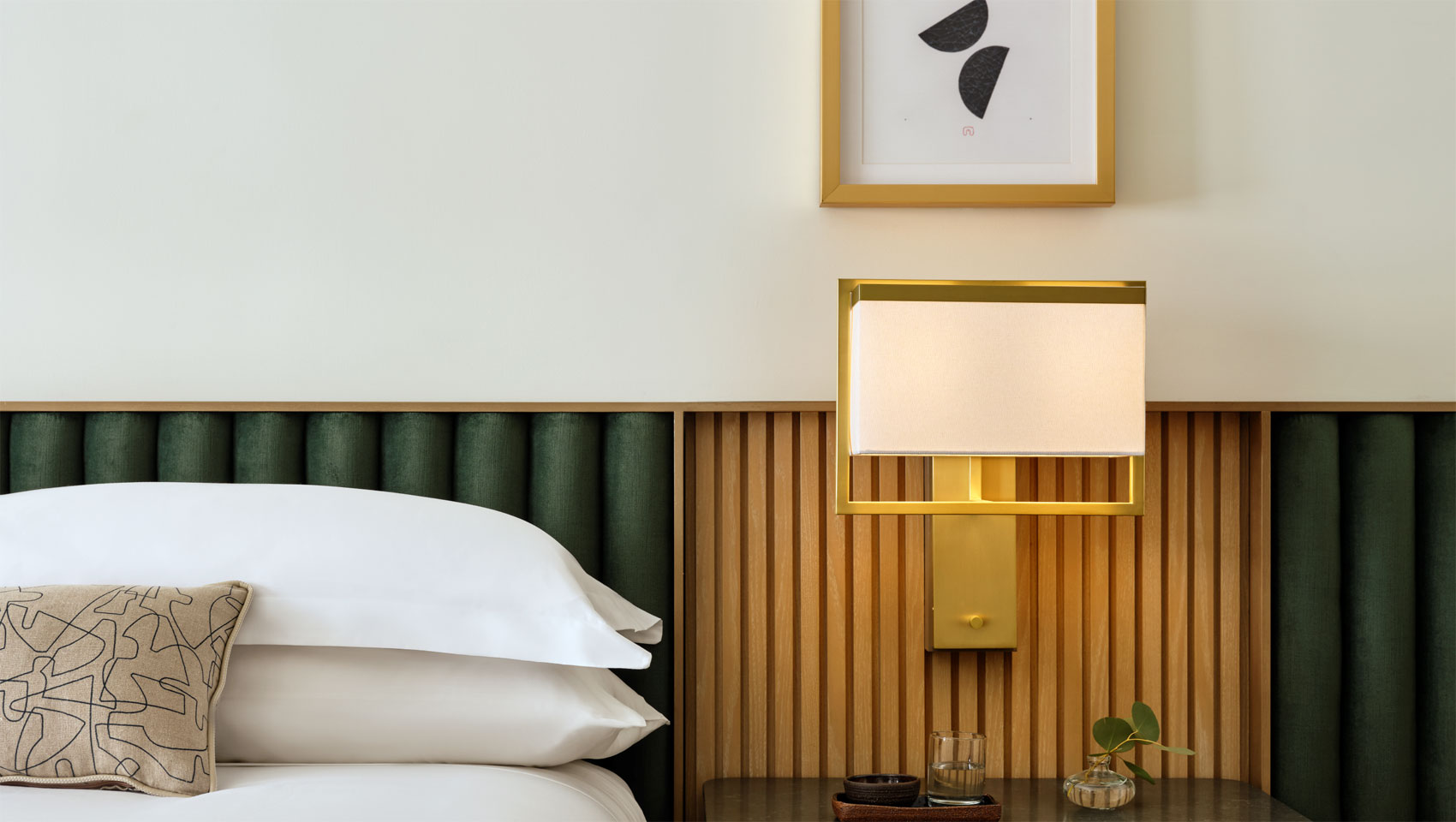 guestroom bed and side table at 70 Park Ave